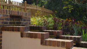 Water cascades down the steps into the circular basin.